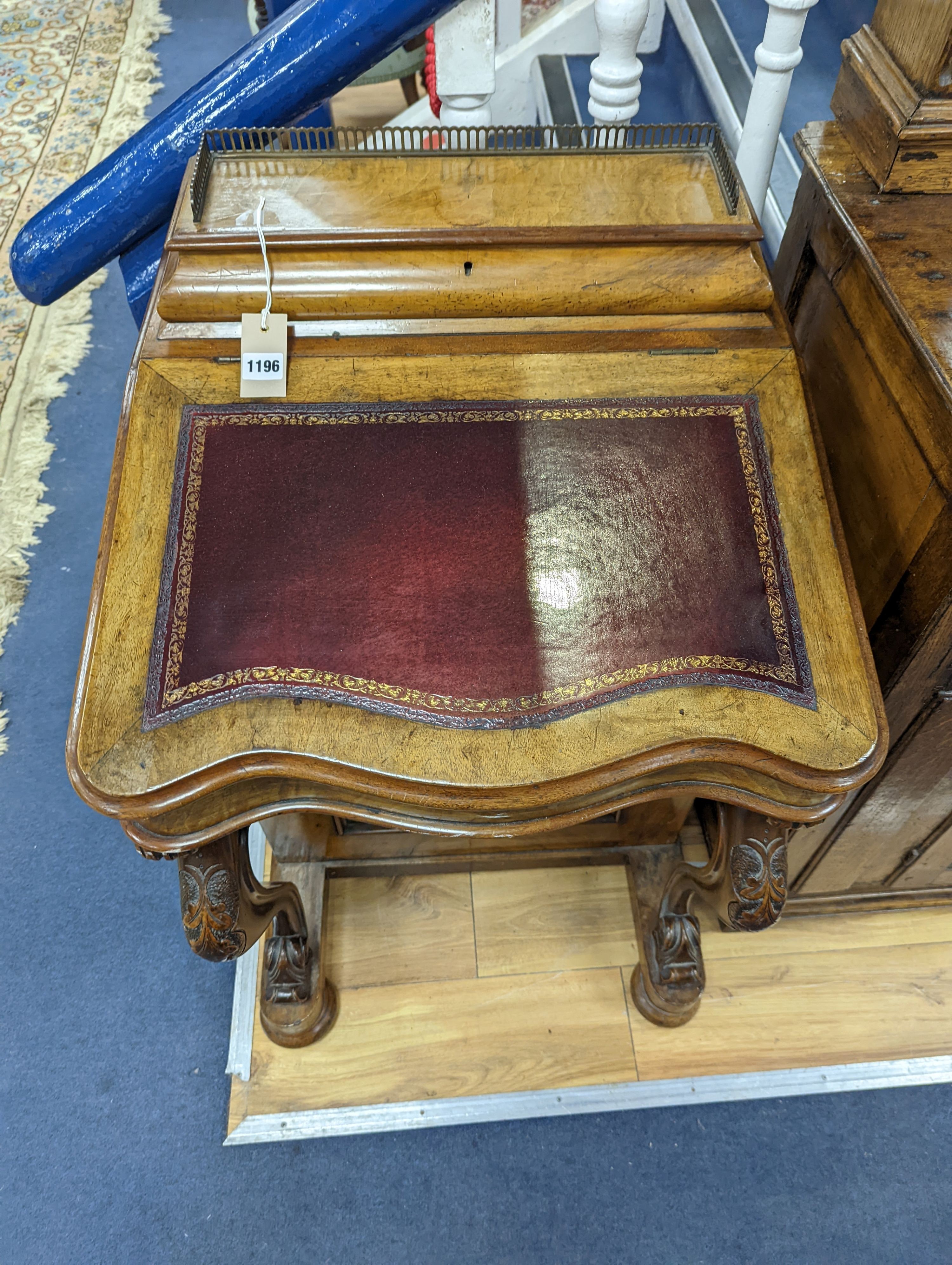 A Victorian walnut Serpentine fronted Davenport, width 55cm